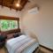 Relax At This Hillside Retreat That Overlooks The Lush Forest And The Caribbean,