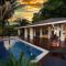 Relax At This Hillside Retreat That Overlooks The Lush Forest And The Caribbean,