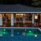 Relax At This Hillside Retreat That Overlooks The Lush Forest And The Caribbean,