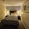 MERRIMAC INN & SUITES