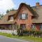 Ferien unterm Reetdach Whg 01