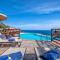 Villa Patty with infinity pool in front of the sea, parking and wifi
