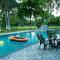 StayVistas Palm Perle Villa - Pet-Friendly Retreat with Terrace, Lawn & Pool Table