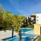 Apartamento en el Eje Cafetero-Aire acondicionado, piscinas, BBQ