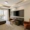 One-Bedroom Apartment and Luxury Penthouse in a Poolside Complex