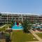 One-Bedroom Apartment and Luxury Penthouse in a Poolside Complex