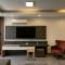 One-Bedroom Apartment and Luxury Penthouse in a Poolside Complex