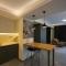 One-Bedroom Apartment and Luxury Penthouse in a Poolside Complex