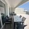 One-Bedroom Apartment and Luxury Penthouse in a Poolside Complex