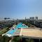 One-Bedroom Apartment and Luxury Penthouse in a Poolside Complex