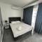 One-Bedroom Apartment and Luxury Penthouse in a Poolside Complex