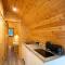 Cosy and eco-friendly cabins next to 16th century pub