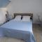 Chambre bleue avec accès plage