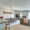 Elevated Fraser Condo with Mountain View and Amenities