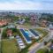 Comfortable holiday homes with a pool, Rewal