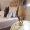 PALAZZO NOVECENTO Centro Storico Rooms & Wellness