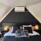 Chambre avec jacuzzi ou Chalets dans les bois Chambre avec jacuzzi ou Chalets dans les bois