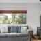 Cosy Getaway with Fireplace and Spacious Backyard