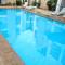 Prestigia 2BR Apartment - Balcony with Pool View - City Center