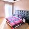 Prestigia 2BR Apartment - Balcony with Pool View - City Center