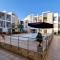 Prestigia 2BR Apartment - Balcony with Pool View - City Center