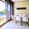 Prestigia 2BR Apartment - Balcony with Pool View - City Center