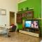 Foto: Studio Apartment Green Wall 8/15