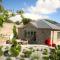 Putsborough Manor 3 Self Catering Cottages with Beach a short walk, dog friendly all year, On site Tennis, Play Area, Paddock, Spa baths, BBQ, Private Gardens, Superfast WIFI