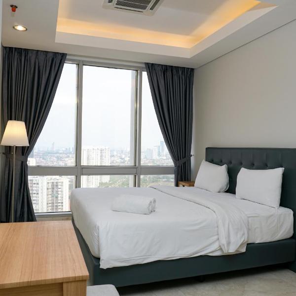 Modern and Comfortable 2BR at The Masterpiece Condominium Epicentrum Apartment By Travelio