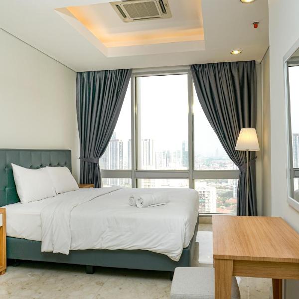 Cozy 2BR @ The Masterpiece Condominium Epicentrum Apartment By Travelio