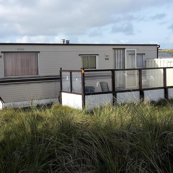 AMELAND-Nes-Duinoord: Stacaravan (chalet) + fietsen direct aan zee!