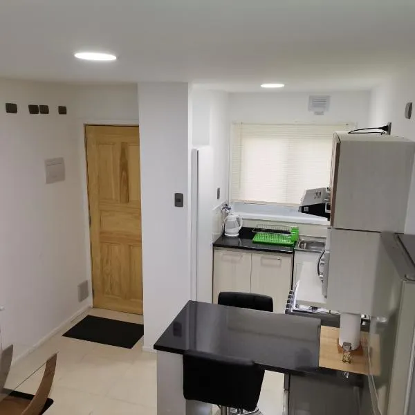 Apartasuite Altos del Bosque, hotel v destinaci Punta Arenas
