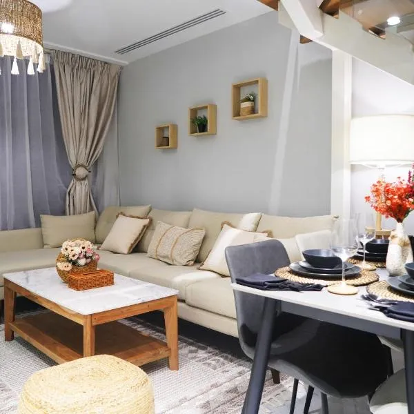 New Jade Serenity - 2BR Urban Retreat, hotel din Al Qurayyah