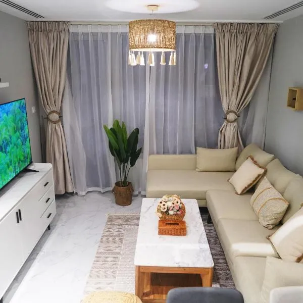 Elegant 2BR Jade Serenity - Modern City Haven, hotell i Al Qurayyah