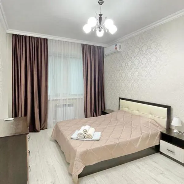 # 21 Солнечная и светлая квартира, hotel in Atyraū