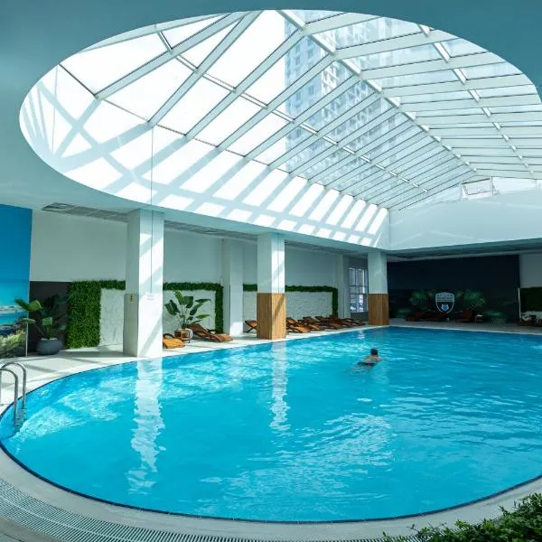 19th Floor Cozy Condo with Pool, Fitness, Parking Included in Price & Self Check in Available, hotel in Skopje