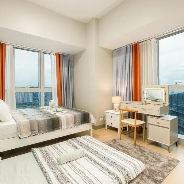 BGC 2BR Uptown Parksuites with balcony and bathtub，位于马尼拉的酒店