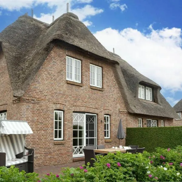 Seesucht-Föhr - Moderne Reet-Haushälfte mit Sauna, Garten & Terrasse nahe Wattenmeer, Hotel in Utersum