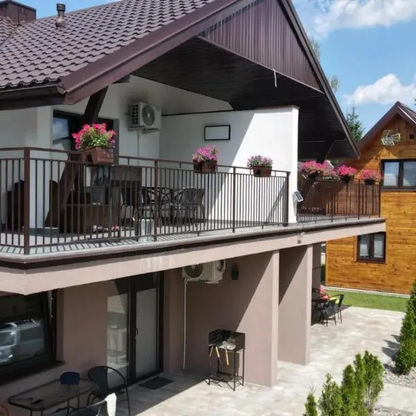 Apartamenty i domki letniskowe Galapagos, отель в Окунинке