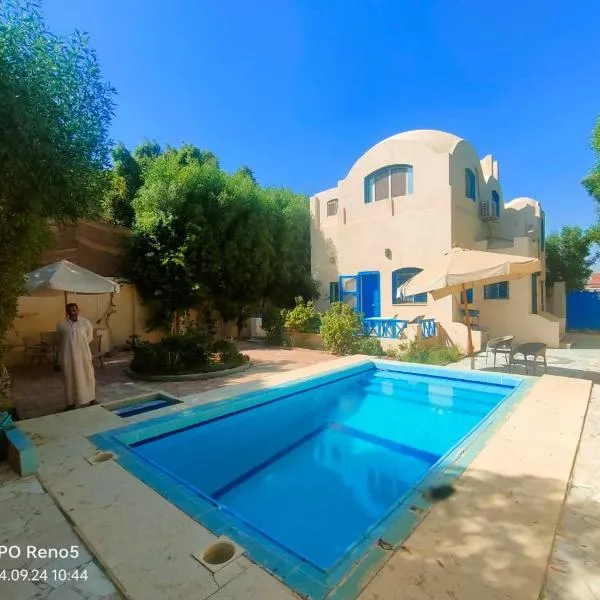 Touha House, hotel en El Fayum