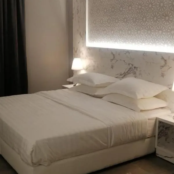 غرفة فاخرة مع دورة مياه ومطبخ بحي الضاحية, hotel in Arar