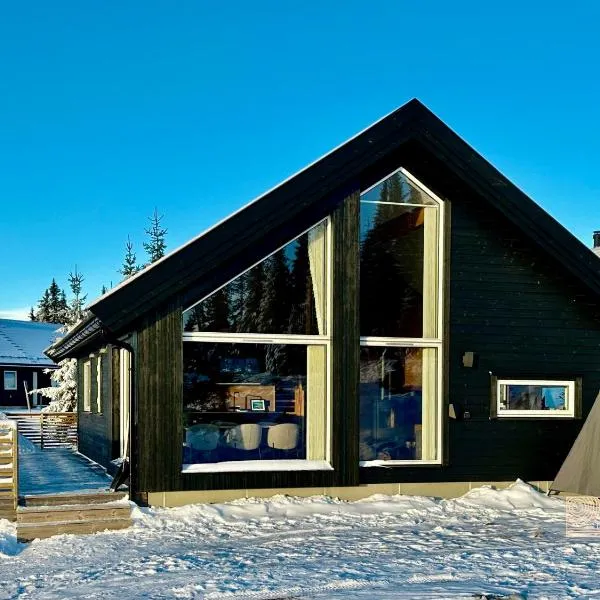 Cozy cabin on Sjusjølia by the trail network sauna, hotel en Ringsaker