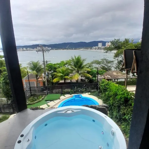 Casamar paraíso na praia com a vista do mar dos sonhos piscina e spa, hotel v destinaci Guarujá