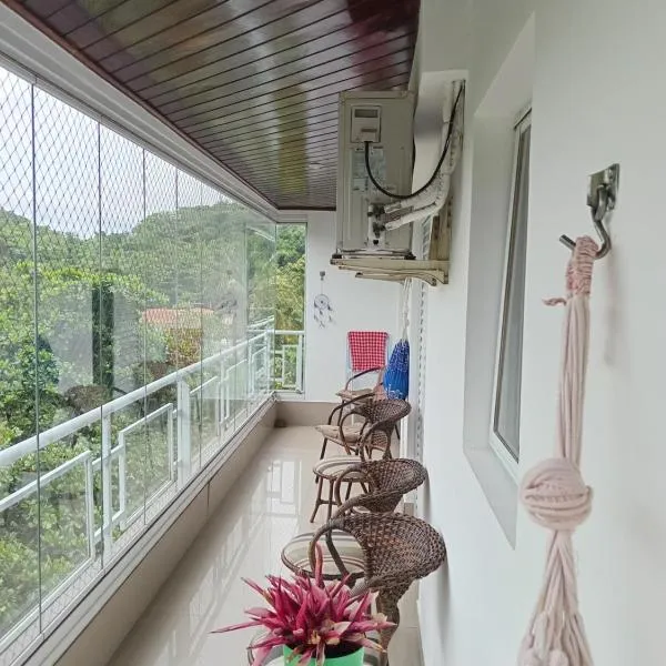 Apartamento Veleiros da Ilha - Praia do Tombo, hotel no Guarujá