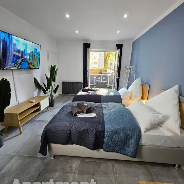 Modern Homes - Voll ausgestatte Wohnung - Balkon - Hotelbetten - 4K TV - WLAN, Hotel in Moers