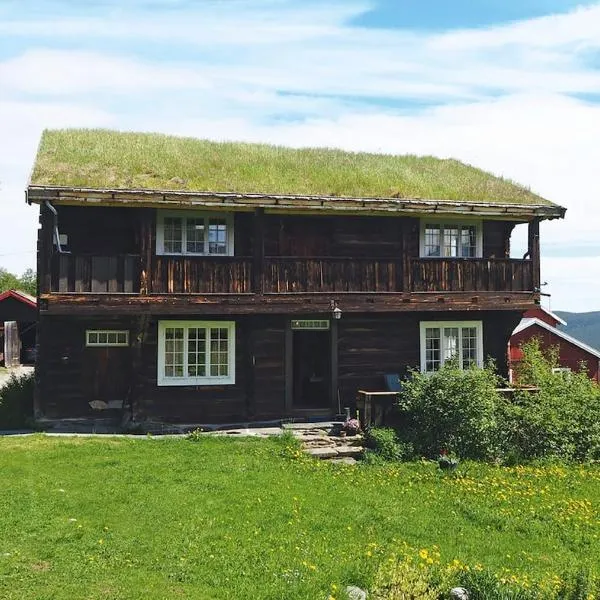 Koselig tømmerhus på gammel gård i Skåbu, hotel a Graupe