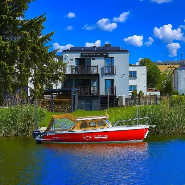 4jeziora - prywatny dostęp do rzeki, pomost, ogrodem, wiata grillowa, rowerek wodny, kajaki w cenie, parking, psiaki dozwolone, отель в городе Илава