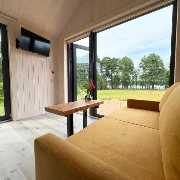 Rātes Krasti - Rasa - holiday house with sauna and lakeview, hotel in Lejasciems