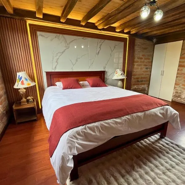 Cabaña en el Campo Malchinguí WIFI 24 horas, hotel sa Malchinguí