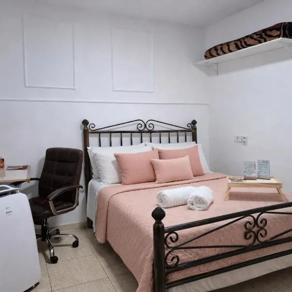 Suíte privativa com ar condicionado - 8min Aeroporto Viracopos, хотел в Кампинас